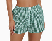 Model wearing green gingham boxers, showcasing a relaxed and stylish look.