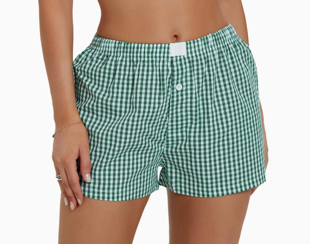 Model wearing green gingham boxers, showcasing a relaxed and stylish look.