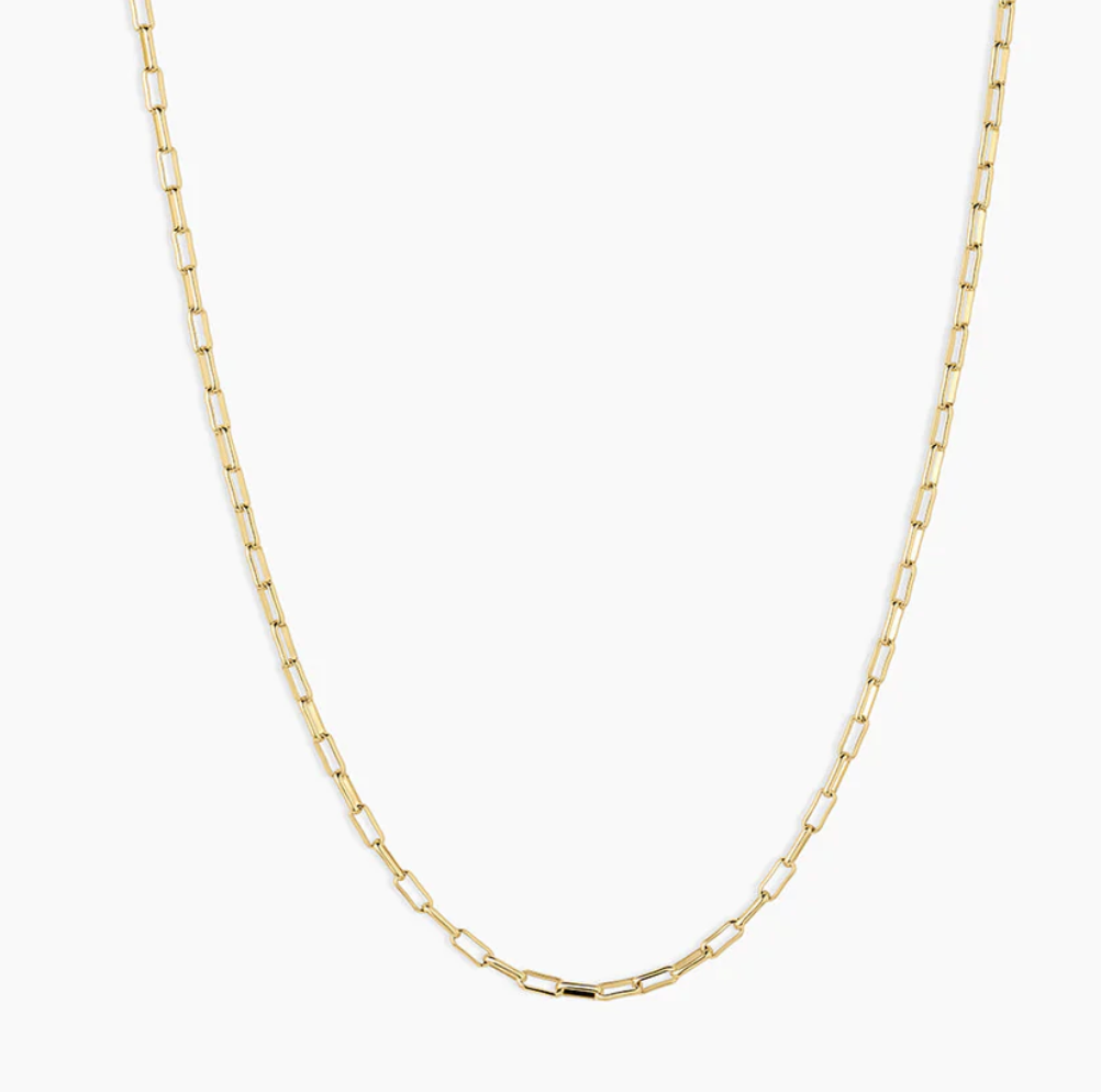 Gold paperclip necklace with a minimalist design, featuring elongated links, suitable for layering or standalone wear.
