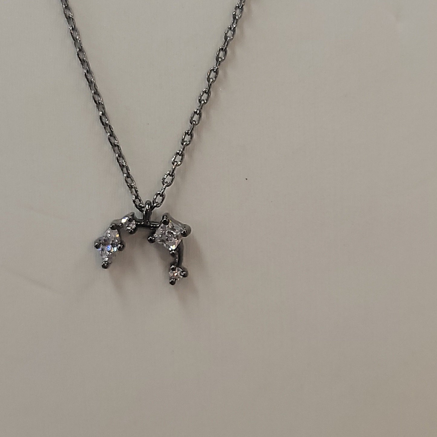 Horn Shaped Necklace W/ Muti Sized CZ