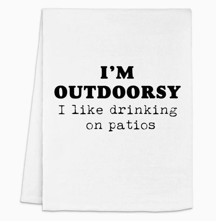 A white towel featuring the phrase "I'm outdoorsy, I like drinking on patios" in bold black text.Get yours today and let your towel reflect your love for outdoor lounging! 🍻✨