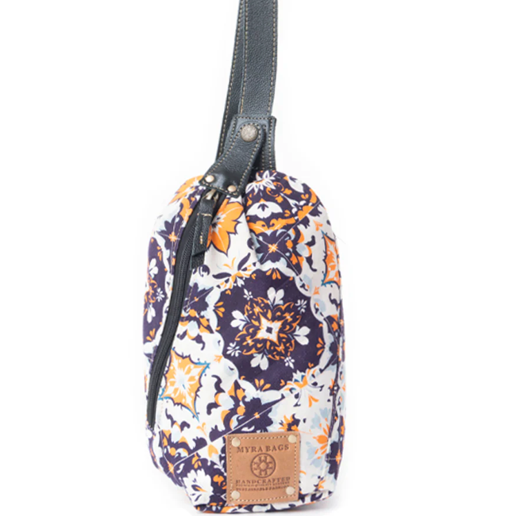 "Oasis Blooms Fanny Pack Bag in black and white floral print with golden accents, leather strap trim, zip closure, and handcrafted design"
