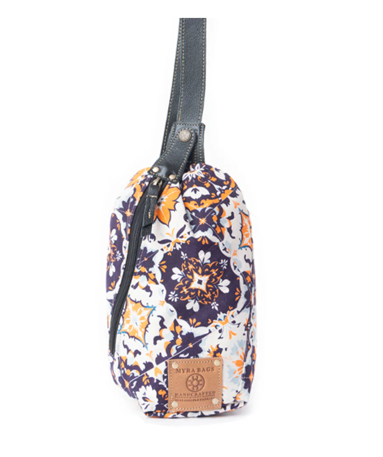 "Oasis Blooms Fanny Pack Bag in black and white floral print with golden accents, leather strap trim, zip closure, and handcrafted design"